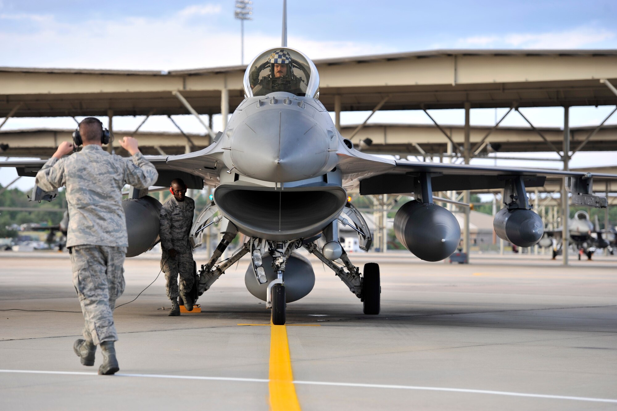 U.S. Air Force Capt. Robert Sandwith, 55th Fighter Squadron F-16 Fighting Falcon pilot, waits to power down his aircraft after returning home from a deployment  Sept. 13, 2013, Shaw Air Force Base, S.C. Sandwith returned from a five-month deployment to the Republic of Korea. (U.S. Air Force photo by Airman 1st Class Jonathan Bass/Released)