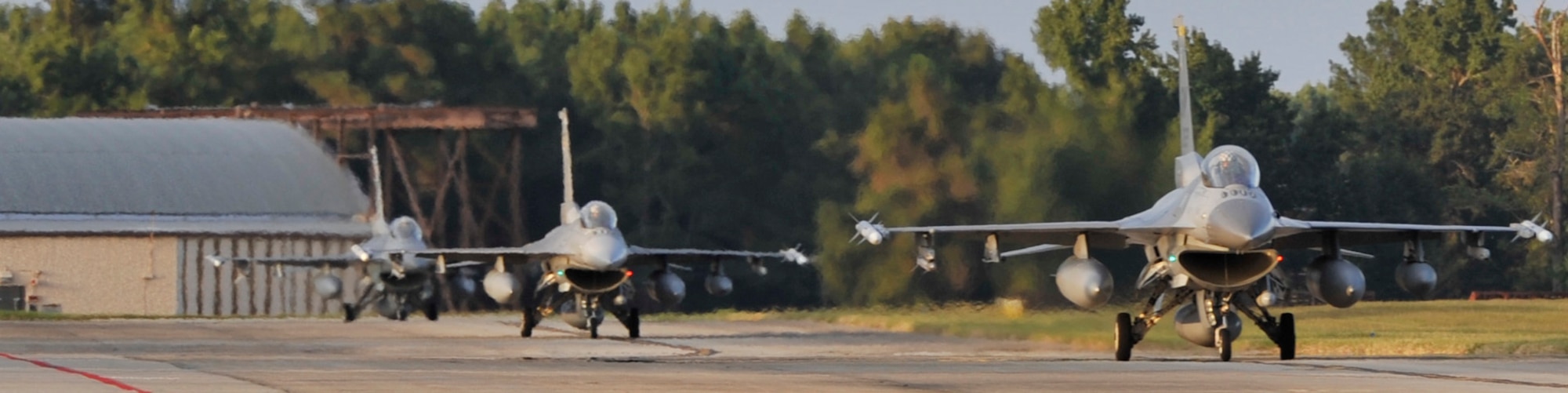 Three F-16 Fighting Falcons from the 55th Fighter Squadron stationed at Shaw Air Force Base, S.C., taxi down the runway after returning home, Sept. 18, 2013. The 55th FS was deployed to the Republic of Korea for the last five months. (U.S. Air Force photo by Airman 1st Class Jonathan Bass/Released)