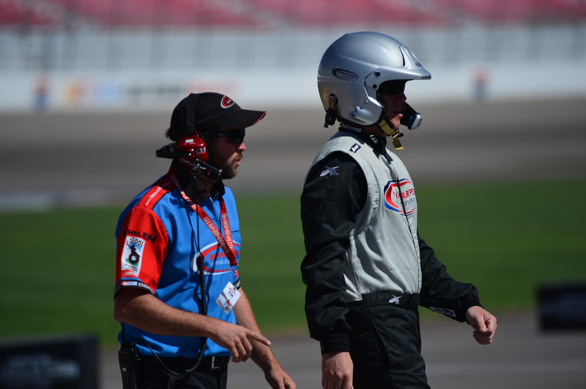 Staff Sgt. Jose Rodriguez, 99th Air Base Wing aerial radio and television broadcaster, exits pit road during an outdoor recreation sponsored Richard Petty Diving Experience at the Las Vegas Motor Speedway in Las Vegas, Nev., Sept. 22, 2013. As part of the Single Airmen Incentive Program, Rodriguez was able to participate in the event and reached a top speed of 134 miles per hour. (U.S. Air Force photo by Staff Sgt. N.B.)