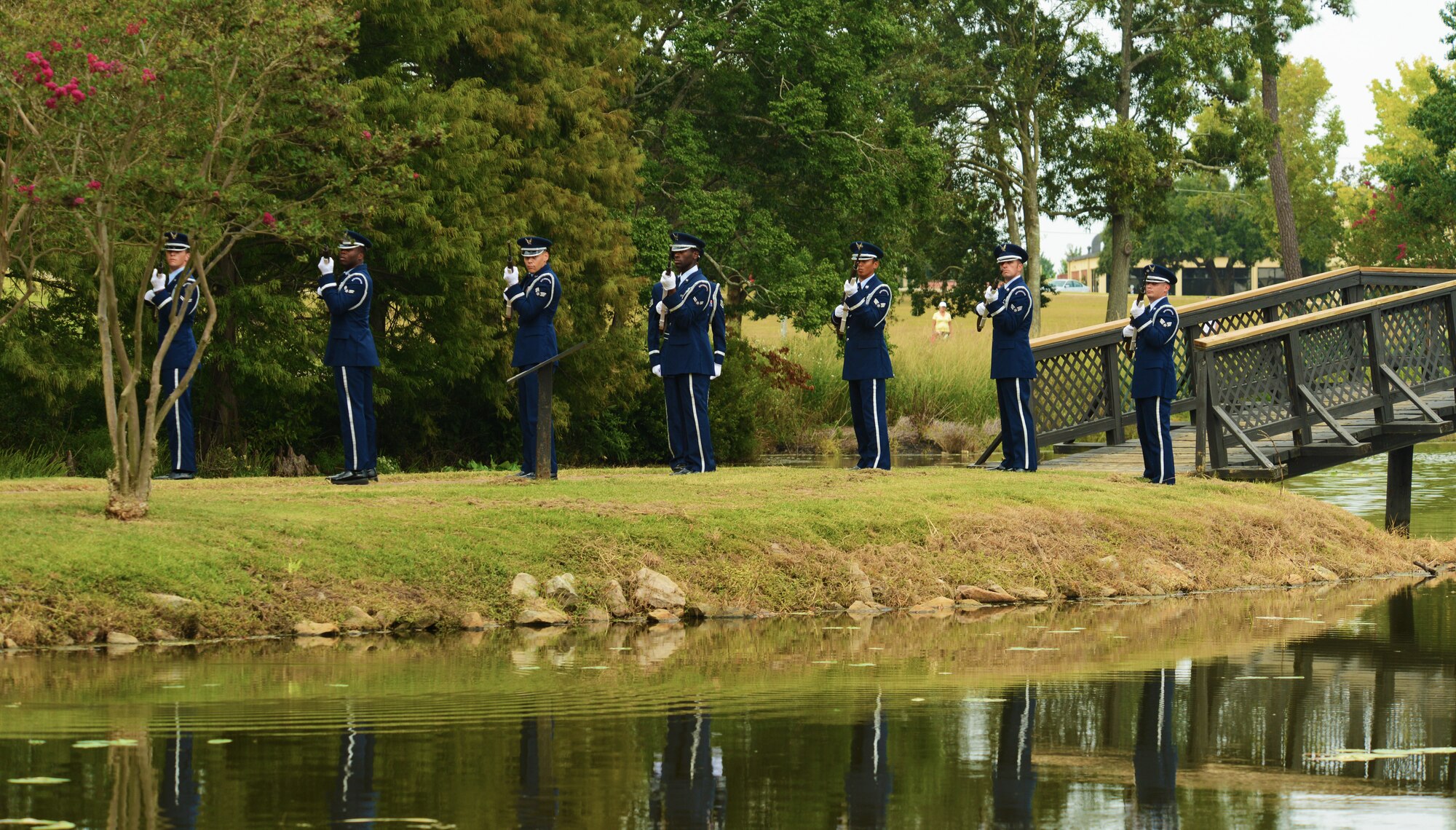 The Shaw Air Force Base Honor Guard performs a twenty-one-gun salute during a Prisoners of War and those Missing in Action Remembrance Day ceremony, Shaw AFB, S.C., Sept. 20, 2013. The ceremony was held at Memorial Lake in honor of those Americans who have fallen, gone missing and/or become prisoners of war. (U.S. Air Force photo by Senior Airman Tabatha Zarrella/Released)
