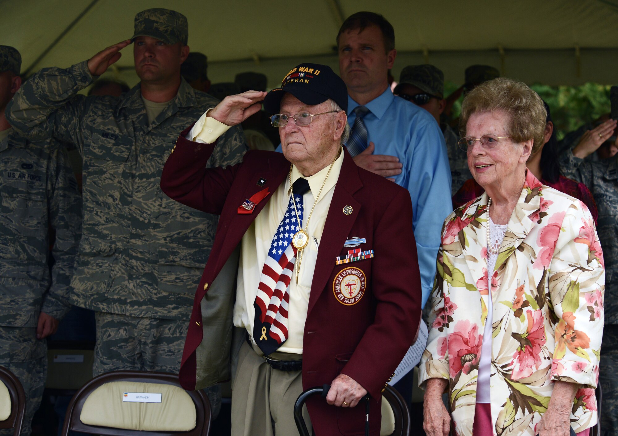 Thomas Grove, World War II prisoner of war, salutes during the twenty-one-gun salute at a Prisoners of War and those Missing in Action Remembrance Day ceremony, Shaw Air Force Base, S.C., Sept. 20, 2013. The ceremony was held at Memorial Lake in honor of those Americans who have fallen, gone missing and/or become prisoners of war. (U.S. Air Force photo by Senior Airman Tabatha Zarrella/Released)
