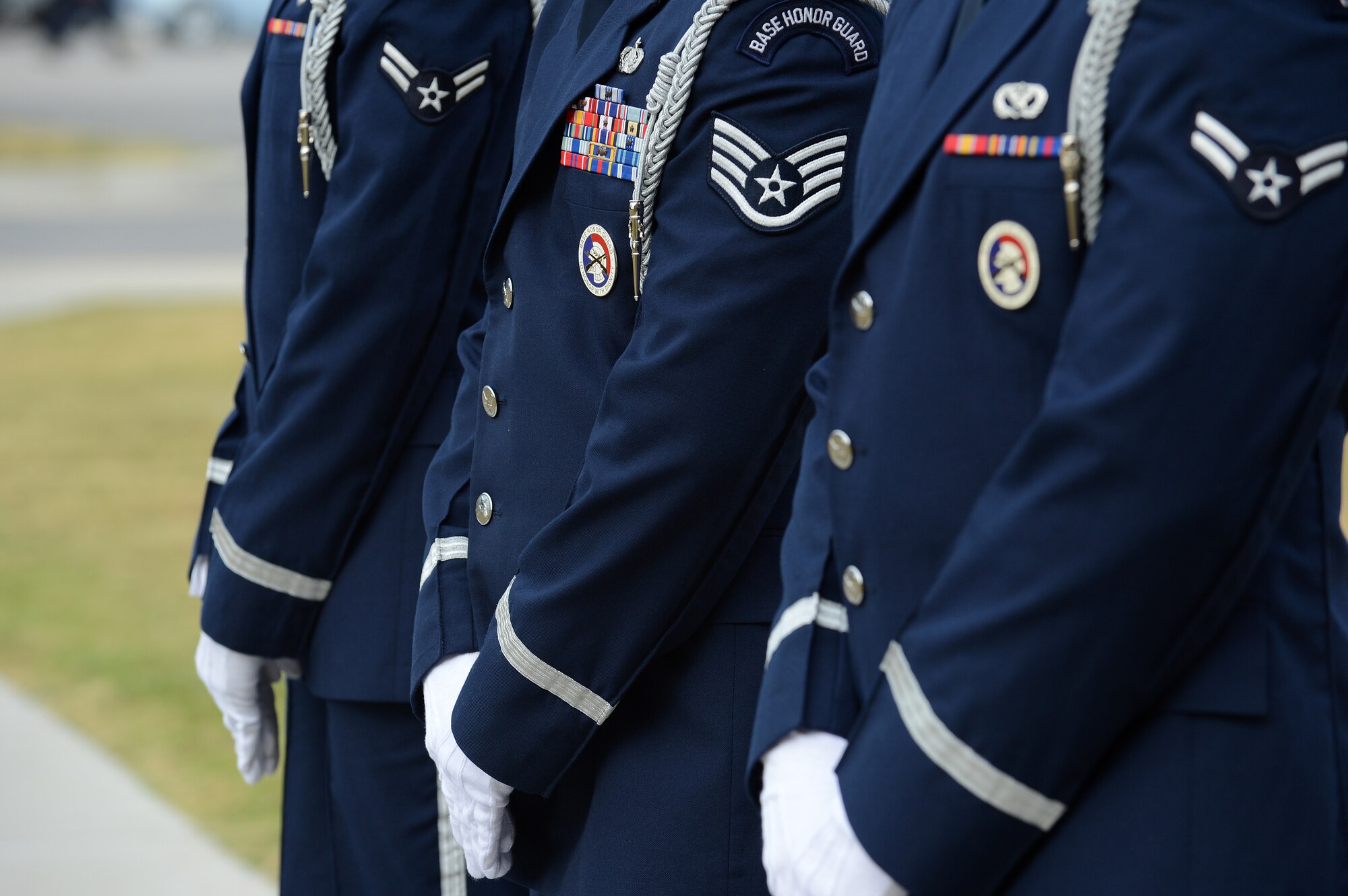 Members of the Shaw Air Force Base Honor Guard stand by before lowering the U.S. flag during a Prisoners of War and Missing in Action Remembrance Day ceremony at Shaw AFB, S.C., Sept. 20, 2013. The ceremony included a World War II POW guest speaker, as well as a 21-gun salute and a wreath-laying ceremony. (U.S. Air Force photo by Airman 1st Class Daniel Blackwell/Released)