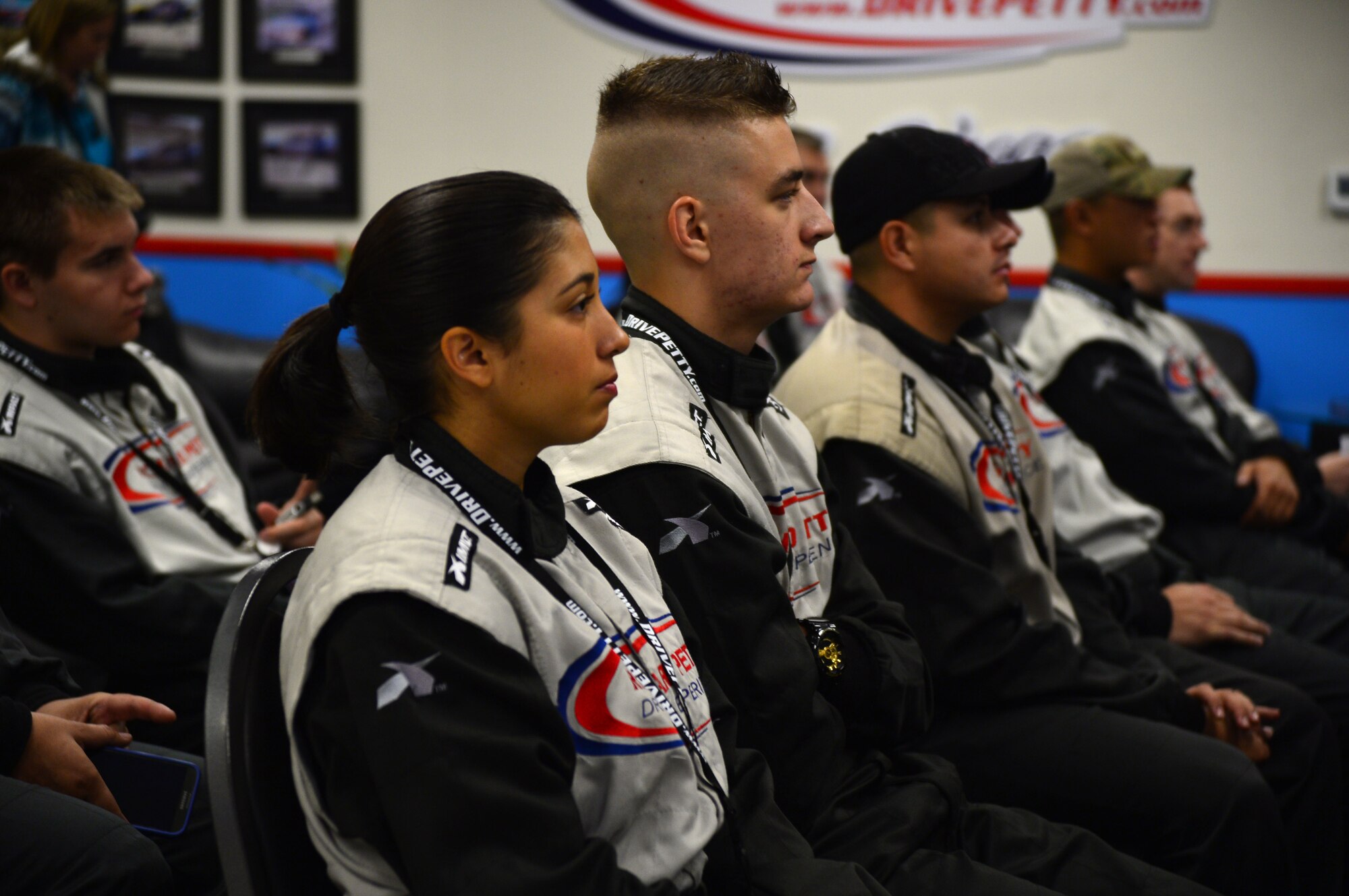 Airmen from Creech and Nellis Air Force Bases are briefed on proper safety techniques during the Richard Petty Driving Experience at the Las Vegas Motor Speedway, Sept. 22, 2013. The event was sponsored by Nellis Outdoor Recreation Single Airmen Incentive Program and like other events it was provided at little or no cost to the participants. (U.S. Air Force photo by Staff Sgt. N.B.)