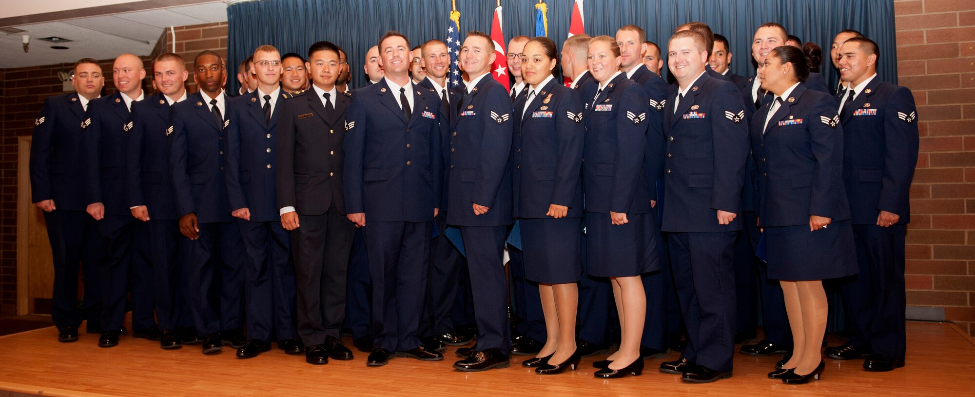 Airmen from the Republic of Singapore Air Force and U.S Air Force stand together after their graduation from Airmen Leadership School at Mountain Home Air Force Base, Idaho, Sept. 12, 2013. For the first time in Air Combat Command, RSAF students participated in ALS alongside U.S. Airmen. (U.S Air Force photo by Airman 1st Class Malissa Lott/ RELEASED)