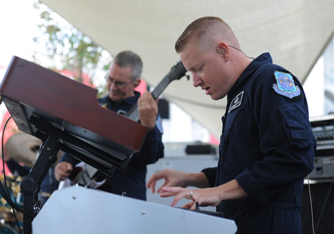 Master Sgt. Jonathan S. McPherson, Max Impact pianist, performs for fans before the Washington Nationals versus Miami Marlins baseball game at Nationals Park, Washington, D.C., Sept. 19, 2013. Airmen from the National Capitol Region participated in various pre-game events and ceremonies in honor of Air Force Night. (U.S. Air Force photo/Airman 1st Class Erin O’Shea)