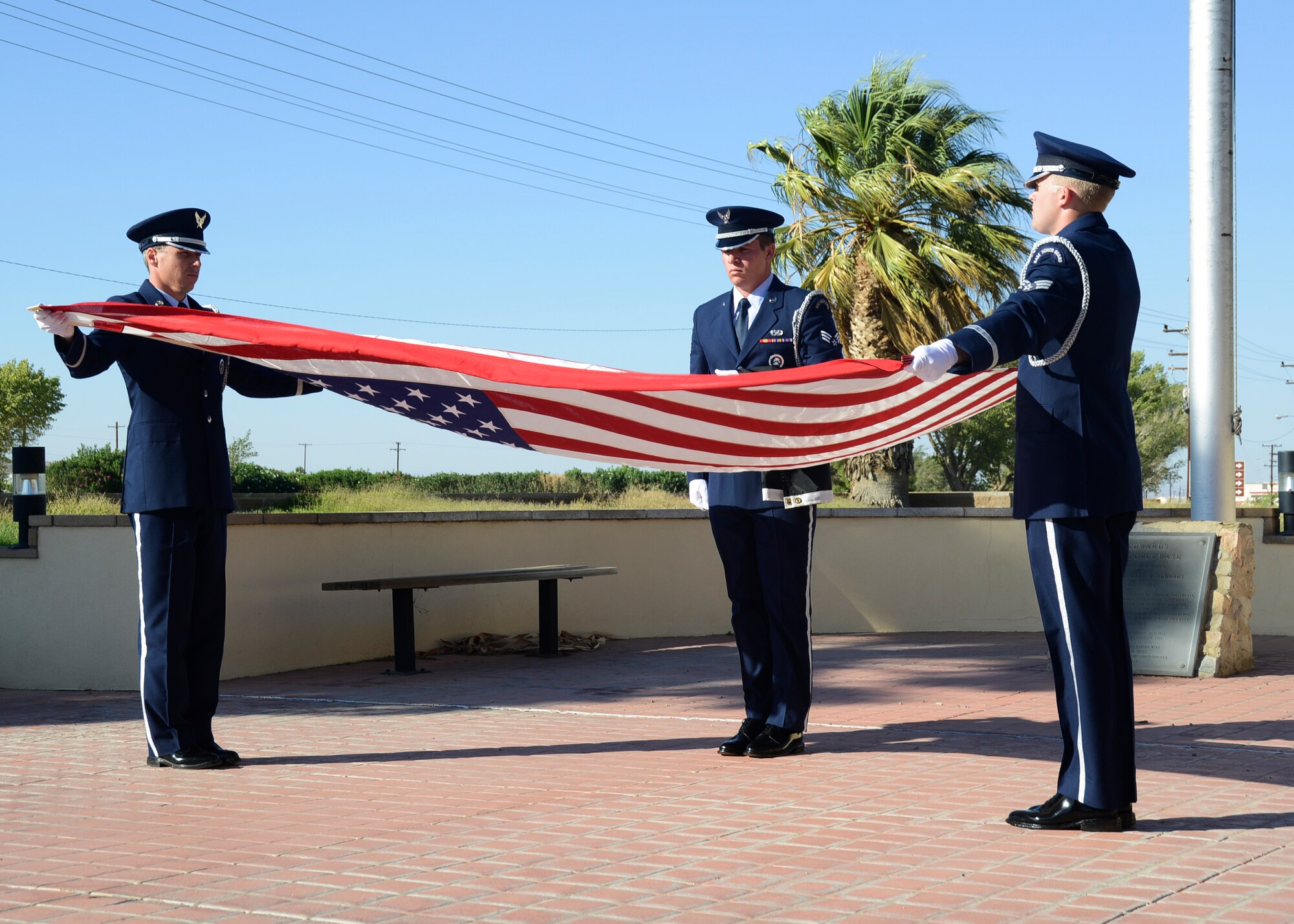 The final tribute on POW/MIA Recognition Day at Edwards AFB, a public flag folding ceremony in front of Bldg. 1 following Retreat.  (U.S. Air Force photo by Rebecca Amber) 