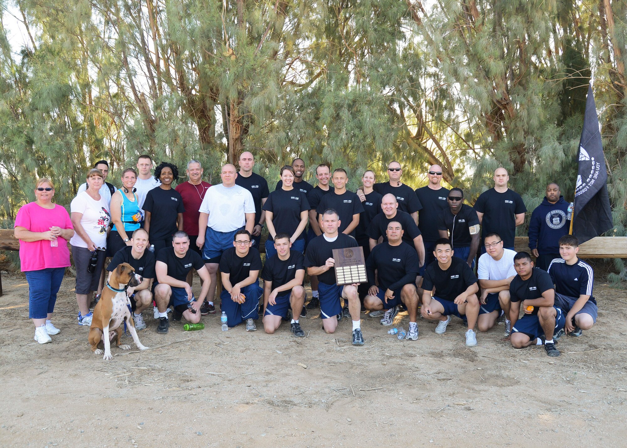 The 412th Communications Squadron received the annual award for the highest number of participants in the POW/MIA 5K with 56 runners. (U.S. Air Force photo by Rebecca Amber) 