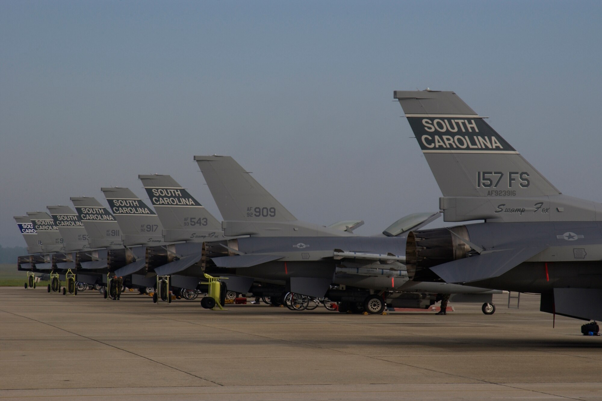 U.S. Air Force F-16 Fighting Falcons assigned to the 157th Fighter Squadron at McEntire Joint National Guard Base, South Carolina Air National Guard, line the flight line on May 15, 2006, before taking off for the Combat Readiness Training Center in Savannah, Ga., to participate in an Operational Readiness Exercise (Phase I ORE). The Phase I ORE evaluates a unit’s ability to process personnel and equipment from home station to a deployed location safely and efficiently. The South Carolina Air National Guard (SCANG) is training for an upcoming Operational Readiness Inspection (ORI) in 2007. (U.S. Air National Guard photo by Senior Master Sgt. Edward Snyder/RELEASED)