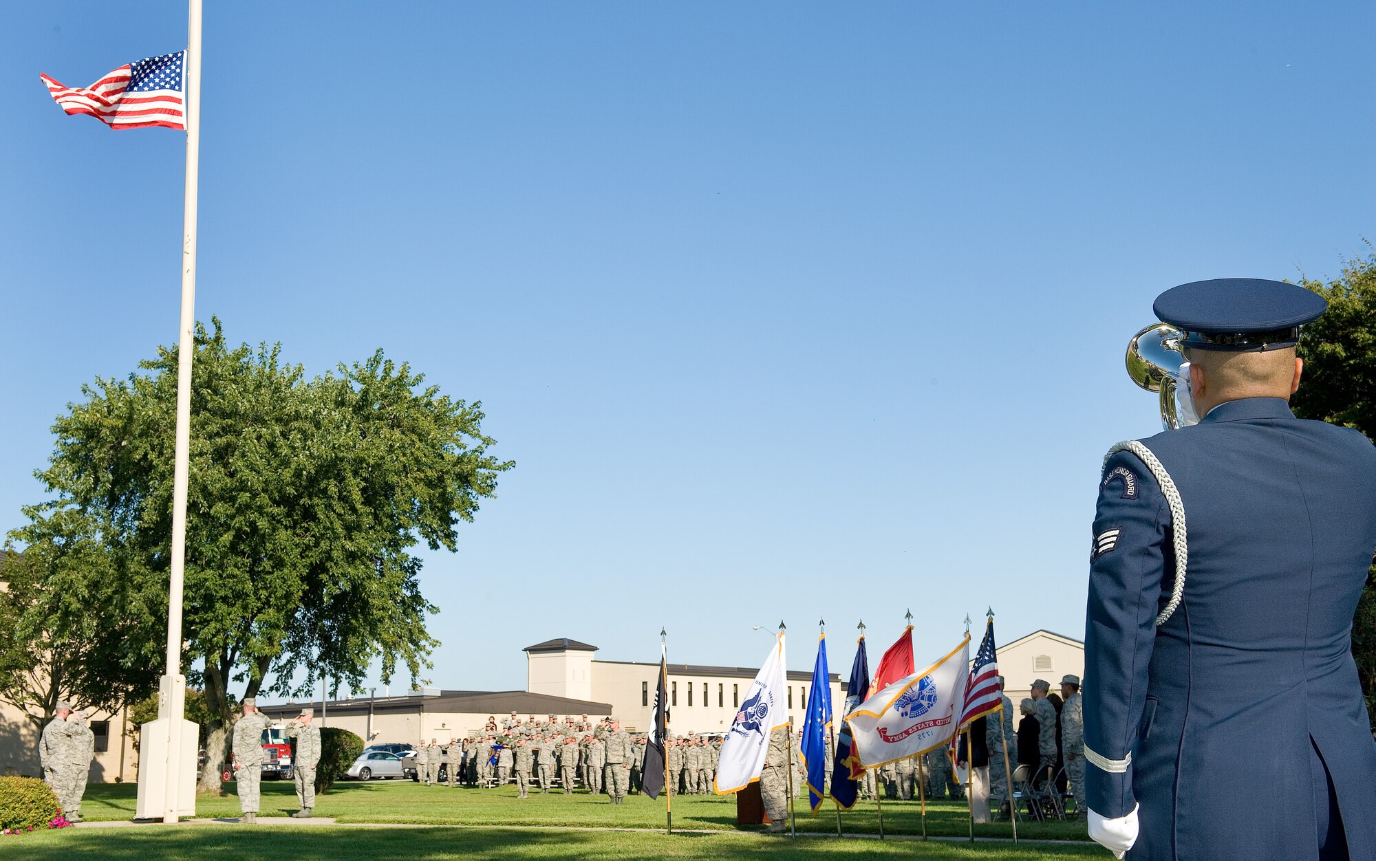 Senior Airman Manuel Alvarez, Dover Air Force Base Honor Guard, plays the bugle during a prisoner of war/missing in action ceremony Sept. 20, 2013, at Dover AFB, Del. The 24-hour POW/MIA vigil and run culminated at the base flag pole at 4:00 p.m. (U.S. Air Force photo/Roland Balik)