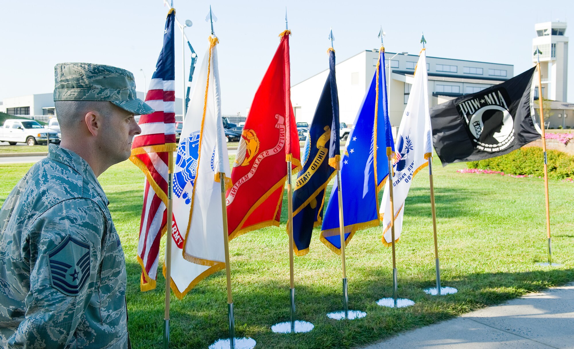 Master Sgt. Bryan McCoy, 436th Operations Support Squadron, stands at parade rest during the prisoner of war/missing in action ceremony Sept, 20, 2013, at Dover Air Force Base, Del. McCoy was the master of ceremonies for the event that honored those listed as MIA, POW, and those who were recently repatriated . (U.S. Air Force photo/Roland Balik)