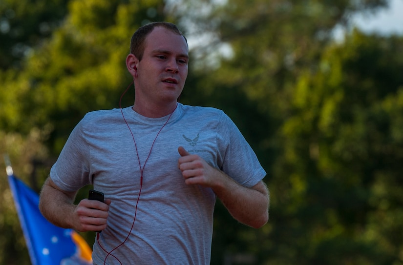 Senior Airman Eathain Duwe, 628th Medical Group medical laboratory technician runs during the POW/MIA Run Sept. 20, 2013, at Joint Base Charleston – Air Base, S.C. Different units from the joint base carried the flag in 30-minute increments from 3:30 p.m. Sept. 19 to 3:30 p.m. Sept. 20 in honor of all POWs and MIAs. Over 660 runners participated in the vigil and logged nearly 2,000 miles. (U.S. Air Force photo/ Airman 1st Class Chacarra Neal)