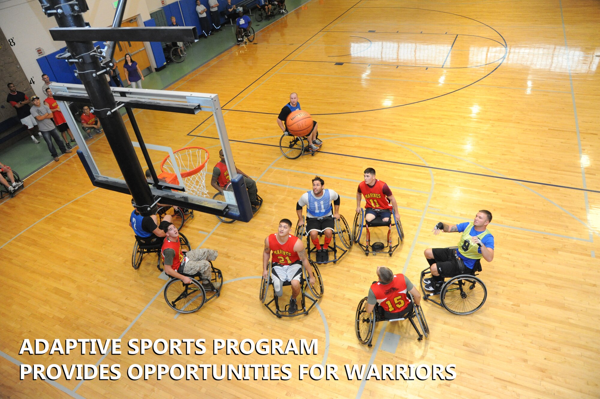 Wounded warriors compete against each other in an Air Force vs. Marine Corps wheelchair basketball game at the Air Force Wounded Warrior Program Adaptive Sports Camp Sept. 19 at the Joint Base San Antonio-Randolph Rambler Fitness Center. (U.S. Air Force photo by Melissa Peterson)