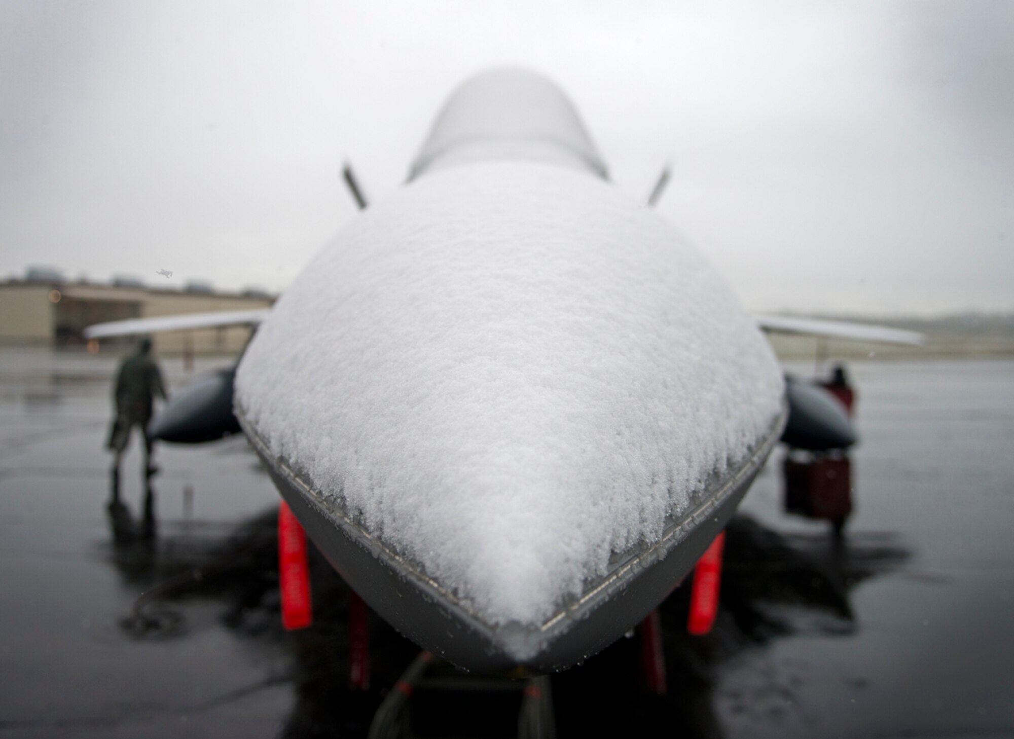 Snow sits atop a F-22A Raptor on Joint Base Elmendorf-Richardson, Sept. 23, 2013. This is one of the earliest snowfalls on record for Anchorage and is just one of the challenges Airmen overcome in Alaska. (U.S. Air Force photo/Staff Sgt. Zachary Wolf)