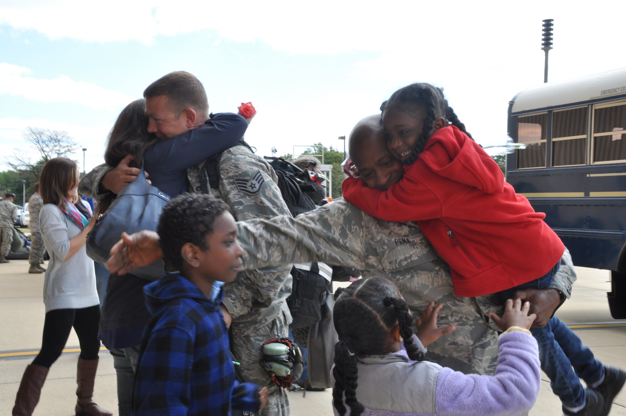 Family members from the 459th Air Refueling Wing, Joint Base Andrews, Md., greet their Airmen returning from an overseas deployment, September 23, 2013. The troops were deployed to Southwest Asia in support of Operation Enduring Freedom. (U.S. Air Force photo/ Staff Sgt. Katie Spencer) 