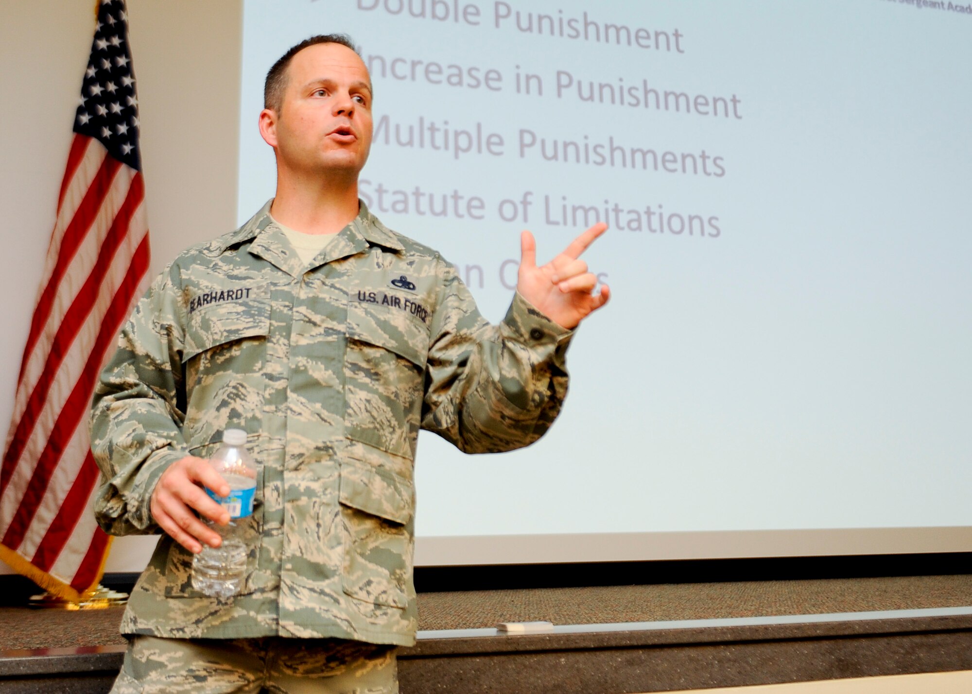 Senior Master Sgt. Phillip Gearhardt, 1st Special Operations Logistic Readiness Squadron first sergeant, briefs at the First Sergeant Symposium on Hurlburt Field, Fla., Sept. 20, 2013. The symposium was a four-day course which taught Hurlburt Field and Eglin Air Force Base NCOs the 'in's and out's' of being a first sergeant. (U.S. Air Force photo / Airman 1st Class Jeff Parkinson)