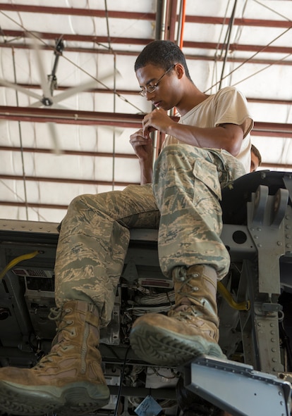 U.S. Air Force Airman 1st Class Phillip Dawson, 723d Aircraft Maintenance Squadron crew chief, inspects a used bolt on top of an HH-60G Pave Hawk at Moody Air Force Base, Ga., Sept. 16, 2013. Airmen clean and inspect removed parts, and if it is deemed to be serviceable, the parts will be reused on the aircraft. (U.S. Air Force photo by Airman 1st Class Ryan Callaghan/Released)
