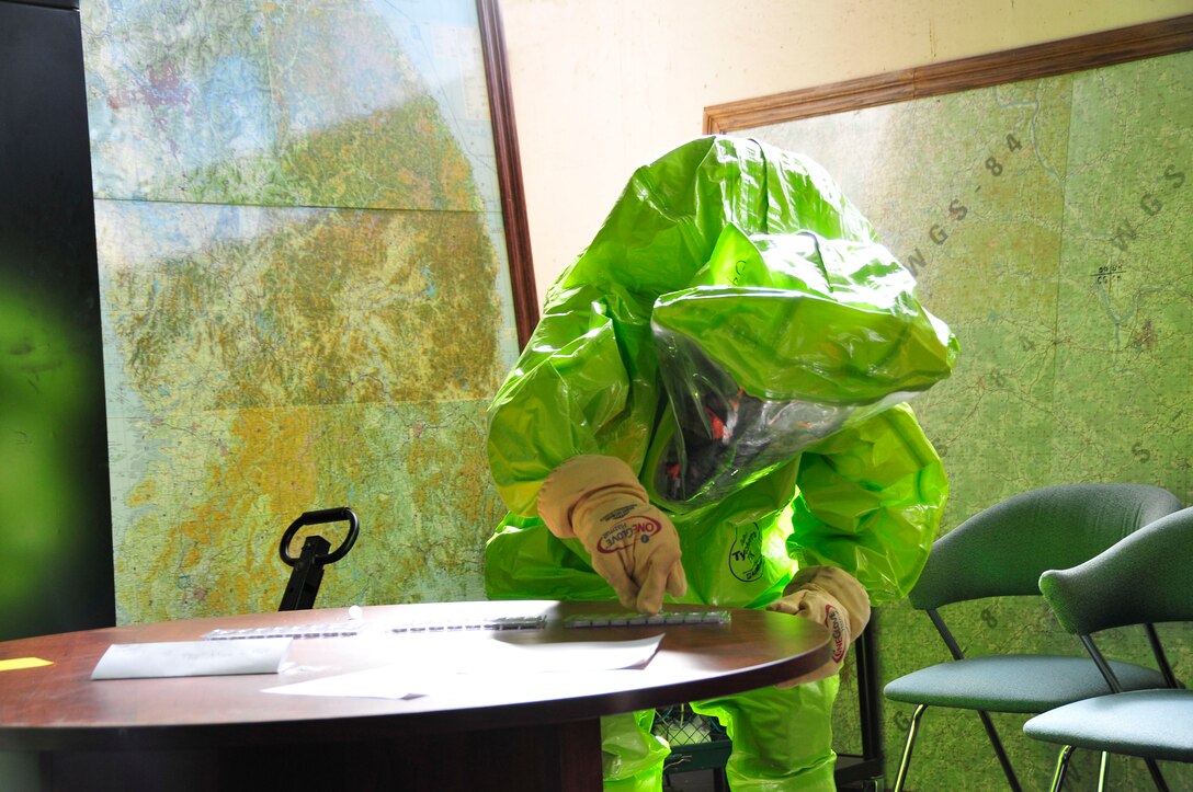 A member of the 134th Air Refueling Wing Civil Engineer Squadron Emergency Management team tests for a hazardous substance during a training exercise Joint Base Pearl Harbor- Hickam, Hawaii August 03-17.  (U.S. Air National Guard photo by Master Sgt. Kendra M Owenby/Released)