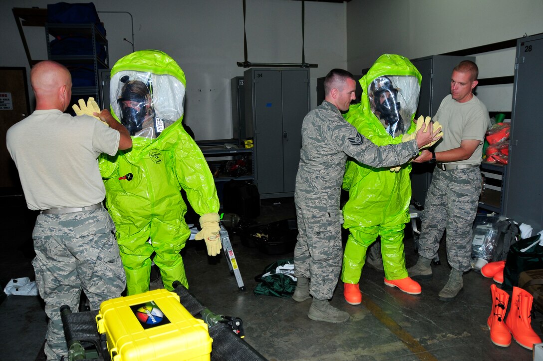Members of the 134th Air Refueling Wing Civil Engineer Squadron Emergency Management team suit up in their equipment to conduct a hazardous material exercise during training at Joint Base Pearl Harbor- Hickam, Hawaii August 03-17.  (U.S. Air National Guard photo by Master Sgt. Kendra M Owenby/Released)