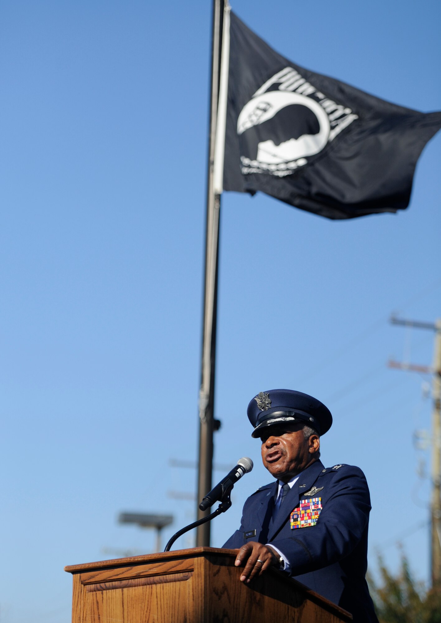 Retired Col. Norman A. McDaniel discusses keeping faith and military history education during his speech at the POW/MIA Recognition Ceremony in Suitland, Md., Sept. 20, 2013. National POW/MIA Remembrance Day is observed across the nation on the third Friday of September each year in support of more than 70,000 POW and MIA personnel. McDaniel, a former U.S. Air Force electronic warfare officer, was shot down over North Vietnam in 1966, and taken as a POW upon his release from captivity in 1973 where he was returned home to American soil. (U.S. Air Force photo/Airman 1st Class Nesha Humes)