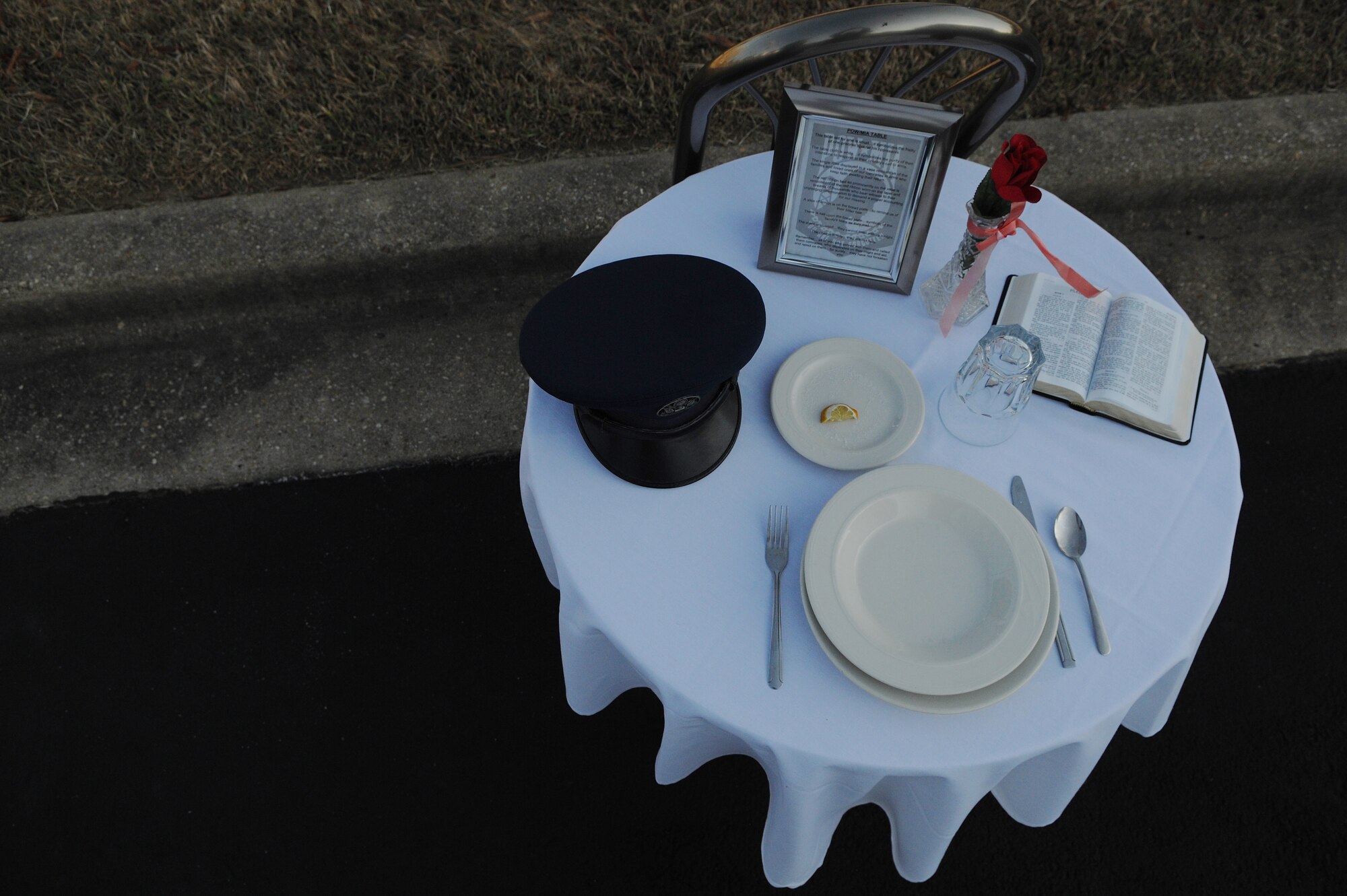 A POW/MIA table sits empty during the POW/MIA Recognition Ceremony at the Airmen Memorial Museum in Suitland-Silver Hill, Md., Sept. 20, 2013. From the red rose to the white linen to the salt upon the plate, all are symbolic in the remembrance of forces missing in action. (U.S. Air Force photo/Airman 1st Class Nesha Humes)
