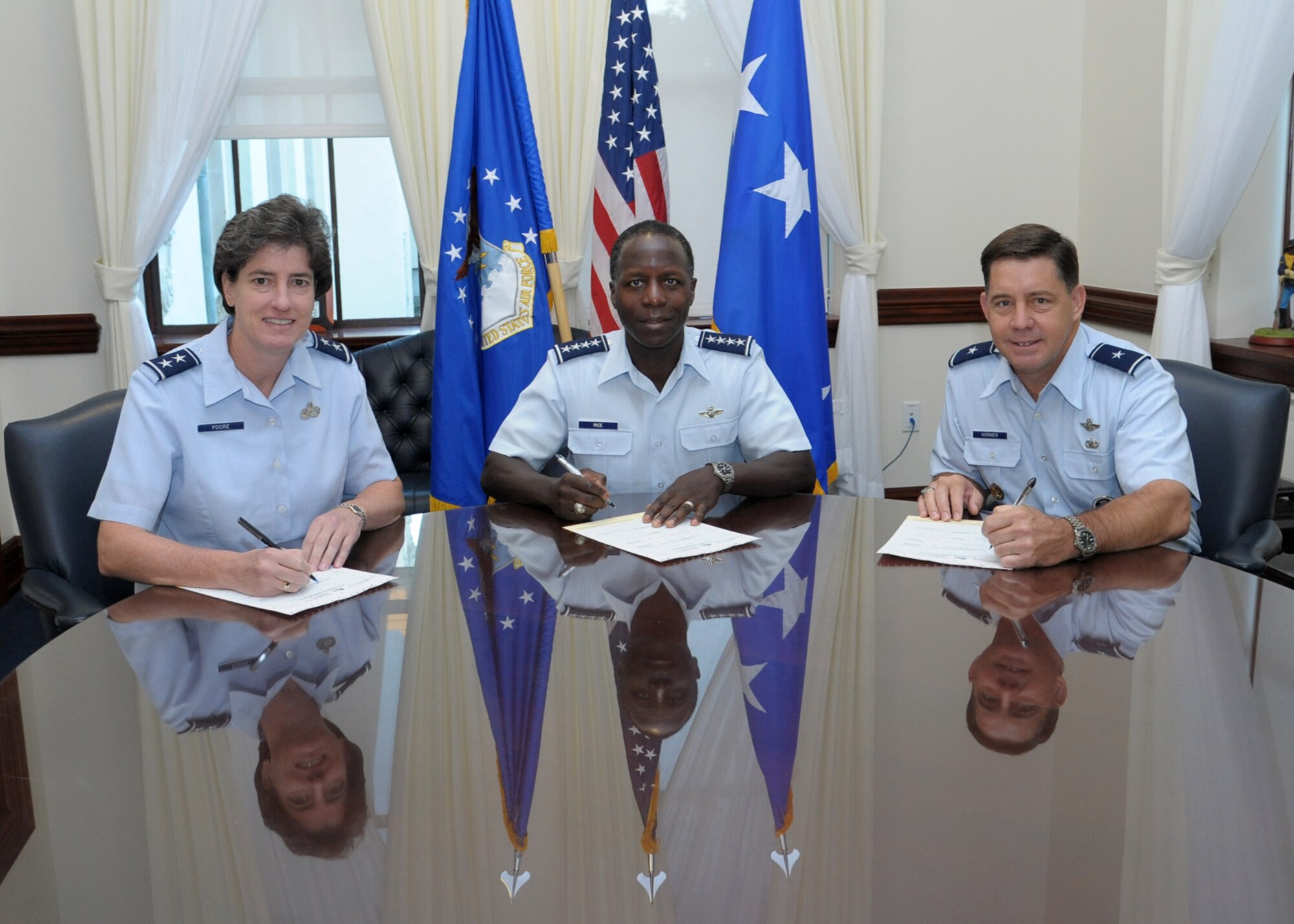 (Center) Gen. Edward A. Rice Jr., Air Education and Training Command
commander, (Left) Maj. Gen. Margaret Poore, Air Force Personnel Center
commander, and Brig. Gen. John Horner, Air Force Recruiting Service
commander, gather to sign Combined Federal Campaign forms Sept. 23 at Joint
Base San Antonio-Randolph. The CFC is one of the largest and most successful
annual charities in today's federal workplace. Airmen can check with their
local CFC representatives for details on their local campaign and how to
donate. (U.S. Air Force photo by Joel Martinez)   

