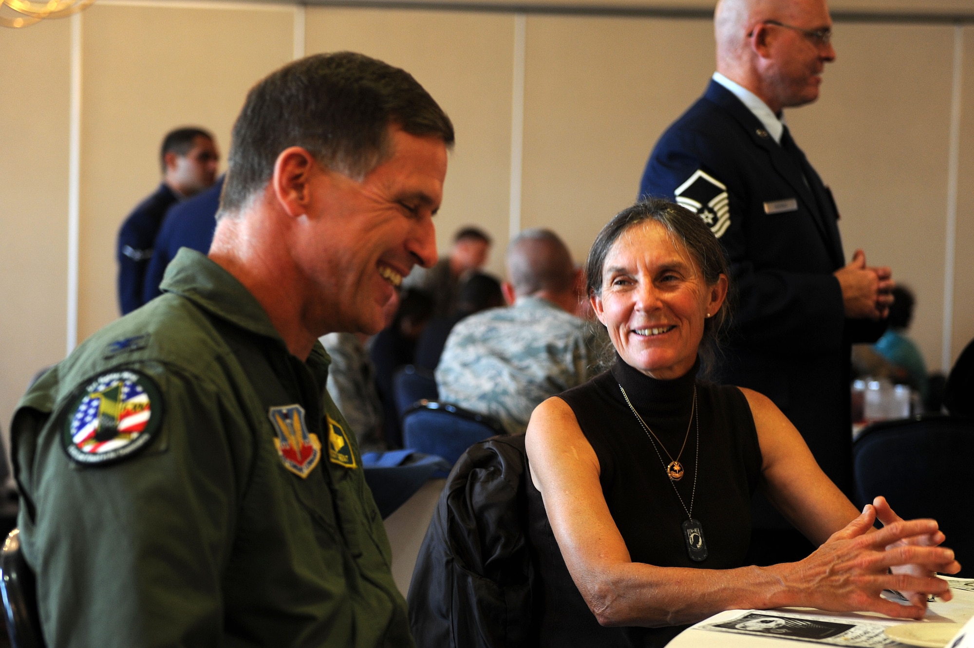 Retired U.S. Army Brig. Gen. Rhonda Cornum converses with U.S. Air Force Col. Scott Gierat, 1st Fighter Wing vice commander, during the POW/MIA Luncheon at Langley Air Force Base, Va., Sept. 20, 2013. Cornum, a prisoner of war survivor, was captured in 1991 after her Blackhawk helicopter was shot down. (U.S. Air Force photo by Senior Airman Brittany Paerschke-O’Brien/Released)