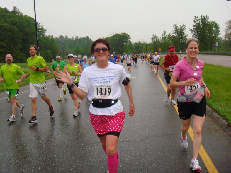 Linda Ambard (center), runs a marathon in Vermont May 28, 2011, approximately a month after her husband Philip was killed in Afghanistan. Her husband challenged her to run a marathon in every state. She will complete her goal in Delaware Oct. 19 and hopes to bring awareness to the importance of the military family. (Courtesy photo) 