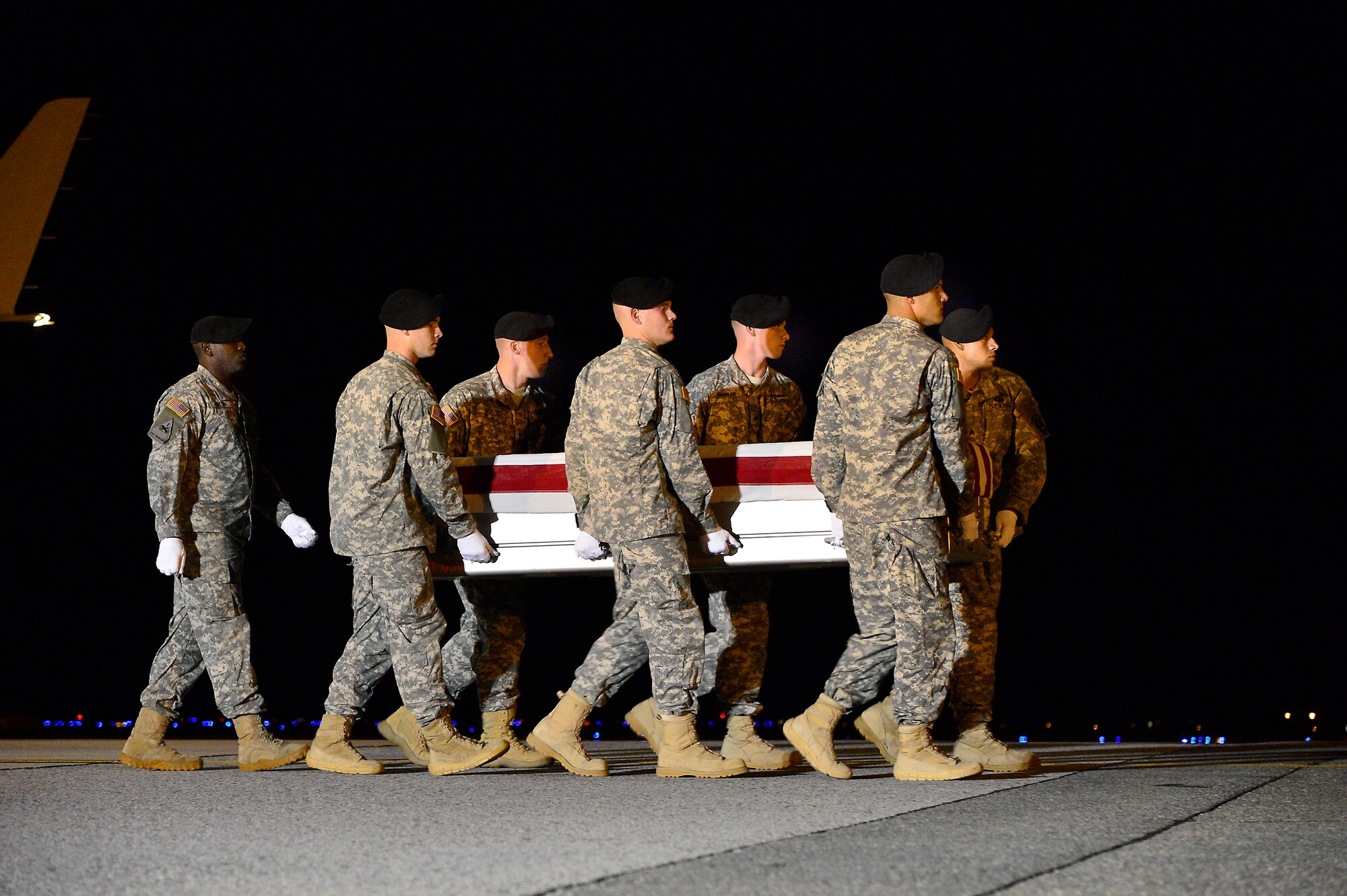 A U.S. Army carry team transfers the remains of Army Staff Sgt. Timothy R. McGill, of Middletown, R.I., at Dover Air Force Base, Del., Sept. 23, 2013. McGill was assigned to the Company A, 2nd Battalion 19th Special Forces Group Middletown, R.I. (U.S. Air Force photo/David Tucker)