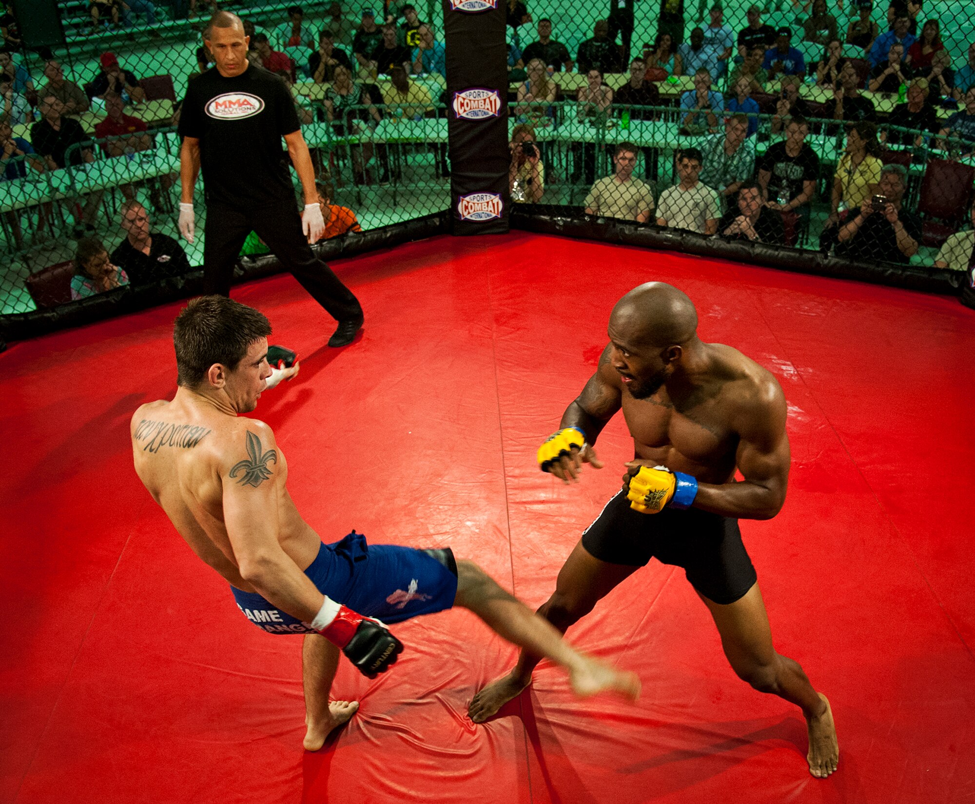 Tony Way delivers a leg kick to Jafar Fortt during their bout at Strike Fight II Sept. 21 at Eglin Air Force Base, Fla.  Way won the fight by submission.  This was Eglin’s second mixed martial arts event.  (U.S. Air Force photo/Samuel King Jr.)  
