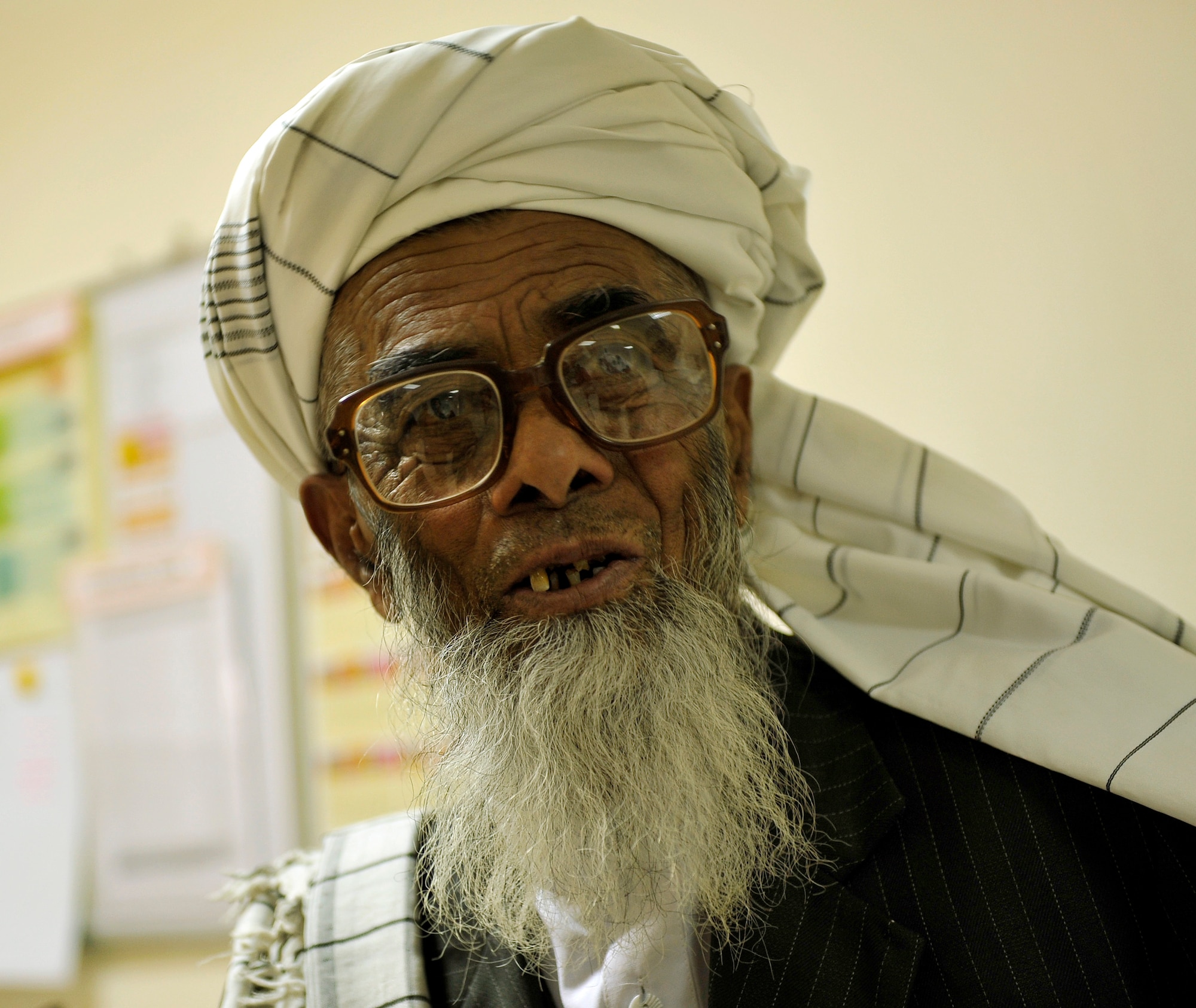 An Afghan patient reads an eye chart during an exam after receiving new prescription glasses during an eye glasses clinic in the Korean Hospital on Bagram Air Field, Afghanistan, Sept. 18. Five months ago after arriving on Bagram, he established a program to provide glasses to Afghan and coalition members in need. The glasses come from former patients and non-profits. This is the second time they have held an eye glasses clinic here. Thus far he has provided glasses to more than 40 people. He is deployed from Keesler Air Force Base, Miss. (U.S. Air Force photo/ Staff Sgt. Stephenie Wade)
