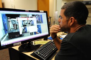 Tony Arroyo, Health and Wellness Center exercise physiologist, analyzes a runner during a gait assessment at Langley Air Force Base, July 9, 2013. The test is used to deteremine biomedical abnormalities that may impact the performance of runners. (U.S. Air Force photo by Airman 1st Class Victoria H. Taylor/Released)