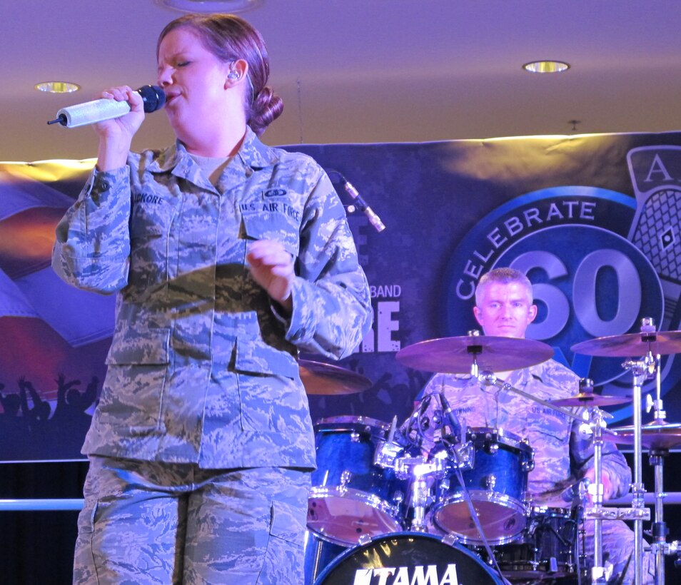 A1C Melissa Lackore steals show at the KMCC stage.  Touch 'n Go and Nightfire (of the U.S. Army in Europe Band) concluded with a joint band performance which brought the audience to its feet.