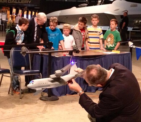 DAYTON, Ohio -- Students plan air drop missions using a model aircraft during Home School Day. (U.S. Air Force photo)