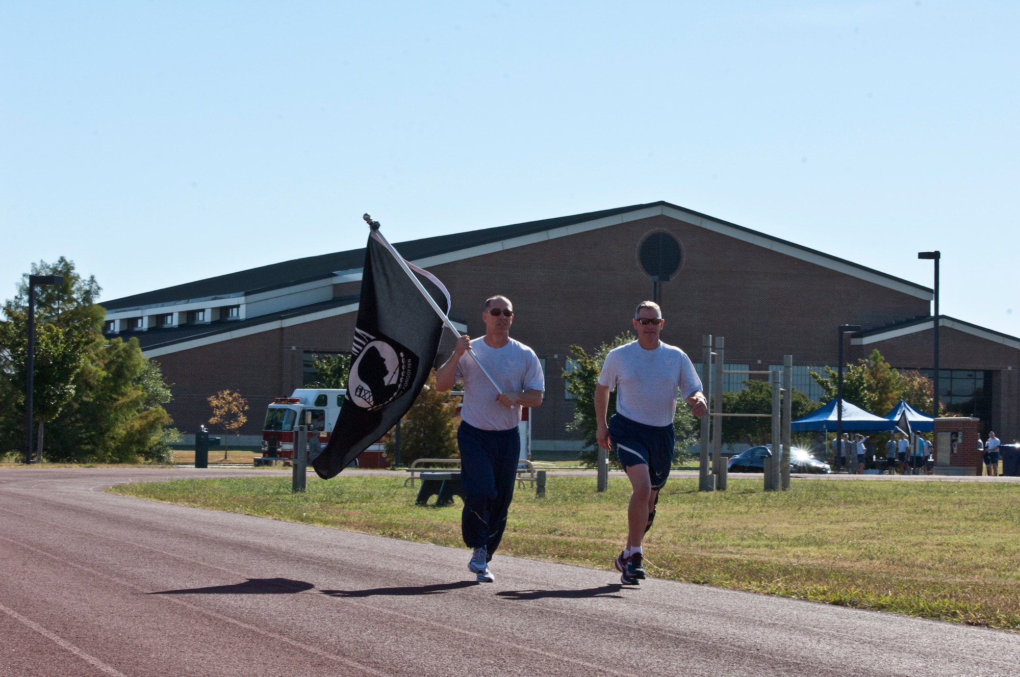 U.S. Air Force Chief Master Sgt. Roger Towberman, left, 480th Intelligence, Surveillance and Reconnaissance Wing command chief, and Chief Master Sgt. Emmette E. Bush Jr., 1st Fighter Wing command chief, run during the POW/MIA 24-hour vigil at Langley Air Force Base, Va., Sept. 19, 2013. Directly after the run, the Recognition Ceremony was held at the Langley POW/MIA memorial. (U.S. Air Force photo by Staff Sgt. Stephanie Rubi/Released) 
