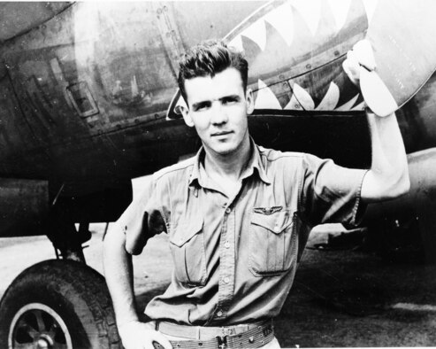 U.S. Army Air Corps Lt. Col. Thomas J. Lynch stands by a P-38 Lightning on the flightline at Papua, New Guinea in 1943. Lynch was a fighter pilot during World War II and a part of the 39th Fighter Squadron in the 35th Fighter Group, known today as the 35th Fighter Wing. Lynch was the top ace for the 39 FS, and during his time with the 35 FG he scored 20 aerial victories. On March 8, 1944, anti-aircraft fire at a low altitude damaged his P-38 and he had to bail out of his aircraft. Because of the low altitude his parachute could not open effectively and he and his aircraft were lost in the jungle below. Declared missing in action, Lynch was never found and is still classified as MIA today. (Courtesy photo by U.S. Army Air Forces, Washington, D.C.) 