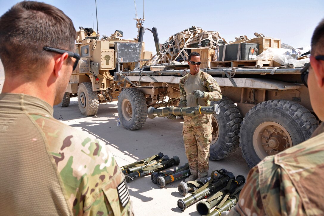 U.S. Army Staff Sgt. Anthony Woods instructs proper inspection, clearing and firing of an M136 AT-4 anti-tank 84mm rocket launcher to troops assigned to Provincial Reconstruction Team Farah during weapons and explosives training on Forward Operating Base Farah, Afghanistan, Sept. 20, 2013. Woods is assigned to the 1st Infantry Division's Company B, 2nd Battalion 1st Infantry Regiment.