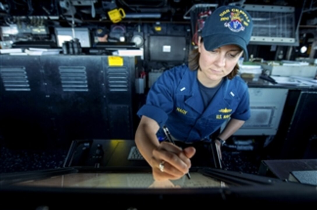 U.S. Navy Lt. j.g. Sarah Nagy tracks surface and air contacts on the bridge of the guided-missile destroyer USS Gravely (DDG 107) as the ship operates in the Mediterranean Sea on Sept. 16, 2013.  Gravely is deployed to the U.S. 6th Fleet area of responsibility to conduct maritime security operations and theater security cooperation efforts.  
