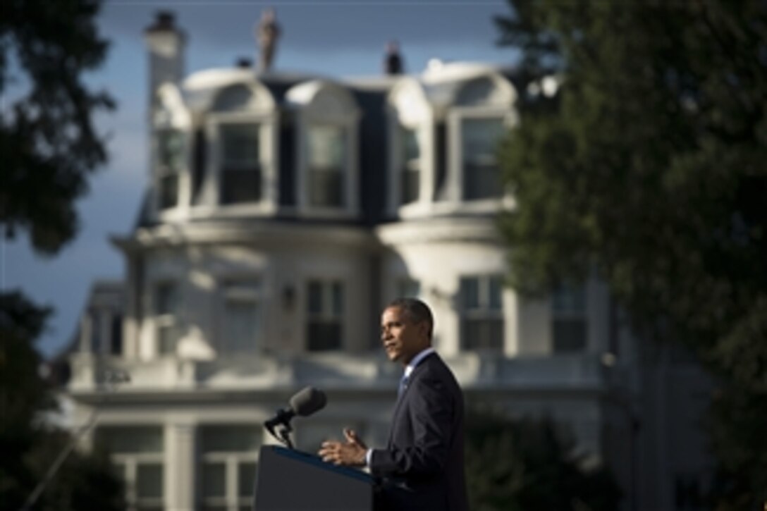 President Barack Obama speaks during a memorial service to honor the 12 victims killed in the Sept. 16th Washington Navy Yard shootings in Washington, D.C., on Sept. 22, 2013.  Secretary of Defense Chuck Hagel joined the president for the private memorial service at the Marine Barracks