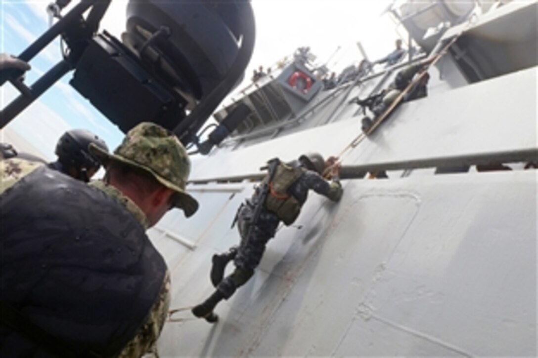 U.S. sailors conduct a visit, board, search and seizure exercise with Bangladeshi sailors during Cooperation Afloat Readiness and Training Bangladesh 2013 in Chittagong, Bangladesh, Sept. 19, 2013. The sailors are assigned to the Maritime Civil Affairs and Security Training Command.