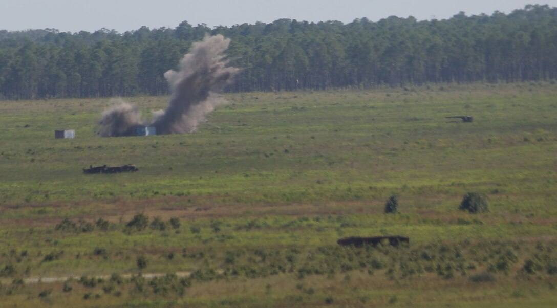 A 2000 pound inert Guided Bomb Unit 24 impacts the target area during the 2nd Air Naval Gunfire Liaison Company, II Marine Expeditionary Force, close air support exercise Sept. 11. An F-15 from 333rd Fighter Squadron, based out of Seymour Johnson Air Force Base, dropped the GBU-24.