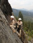 Marines with 2nd Marine Logistics Group climb a mountain during the assault climber’s course at the Mountain Warfare Training Center, Bridgeport, Calif., from Aug. 16 to Sept. 13, 2013. The Marines learned repelling, pack repelling, rock climbing, top roping, escape and evasion techniques, and shelter building, and performed long movements in between exercises.