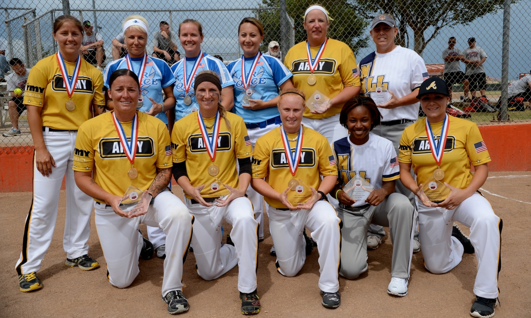 Your 2013 Armed Forces Softball All-Tournament Team.  

Outfield:  SSgt Candice Dugo – USAF Beale AFB, CA
Outfield:  SGT Leina Braxton – Army Fort Bliss, TX
Outfield:  EN3 Janiccia Taylor – Navy USS Dwight D Eisenhower
Outfield:  SPC Melissa Graves – Army Fort Bragg, NC
Infield:  SPC Miranda Campbell – Army Camp Casey, Korea
Infield:  SGT Jenna Martin – Army JB Meyer-Henderson Hall
Infield:  SSgt Jeana Whiteman – USAF Osan AB, Korea
Infield:  Capt Kristina Dempsey – USAF Suffolk, VA
Utility Player:  LTC Terri Andreoni – Army Fort Bliss, TX
Utility Player:  MR1 Christian Camp – Navy USS Abraham Lincoln
Utility Player:  1LT Britnee Arvella – Army MASS ARNG
