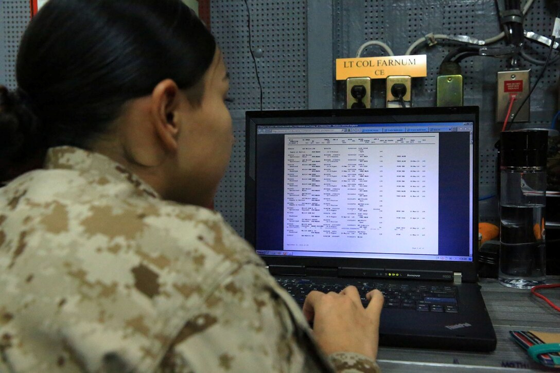 U.S. Marine Cpl. Didivalis Cruz, maintenance management clerk with 13th Marine Expeditionary Unit, analyses task and transaction records kept using the Global Combat Support System-Marine Corps aboard the USS Boxer, Sept. 25. The Marines and Sailors with 13th MEU will deploy for several months in support of theater requirements of Geographic Combatant Commanders. (Marine Corps Photos by Sgt. Jennifer Pirante/RELEASED)