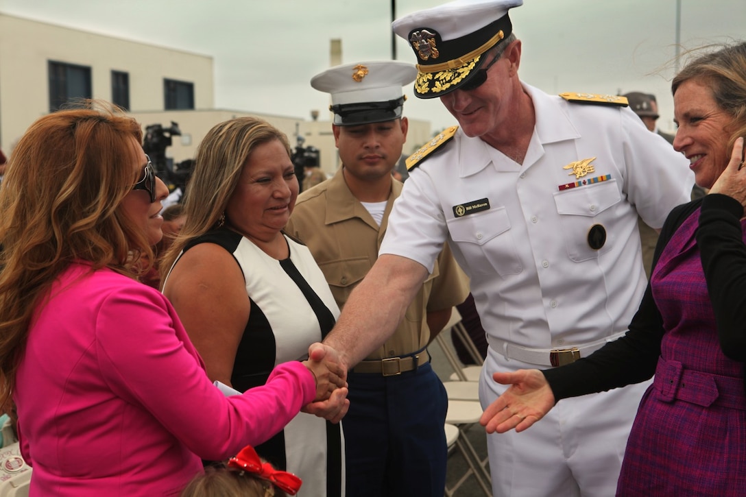 Commander of the United States Special Operations Command, Admiral William McRaven greets the family of Navy Cross recipient, Sgt. Rafael Peralta, during a ship naming ceremony aboard Naval Base San Diego, Calif., Sept. 20. McRaven is best known for leading the mission to capture Osama bin Laden in 2011.
