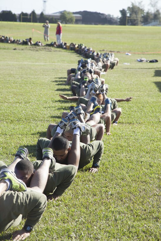 Service members attempt to set a world record for the largest squad pushup aboard Marine Corps Base Camp Lejeune, Sept. 18. More than 130 service members participated in the event, organized by Camp Lejeune’s Single Marine Program.