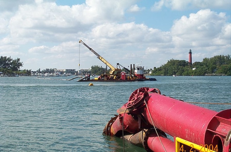Dredging of the Intracoastal Waterway is accomplished with a cutter suction dredge, which is propelled forward by spuds at the rear of the dredge. Anchor booms allow the dredge to turn and maneuver. 