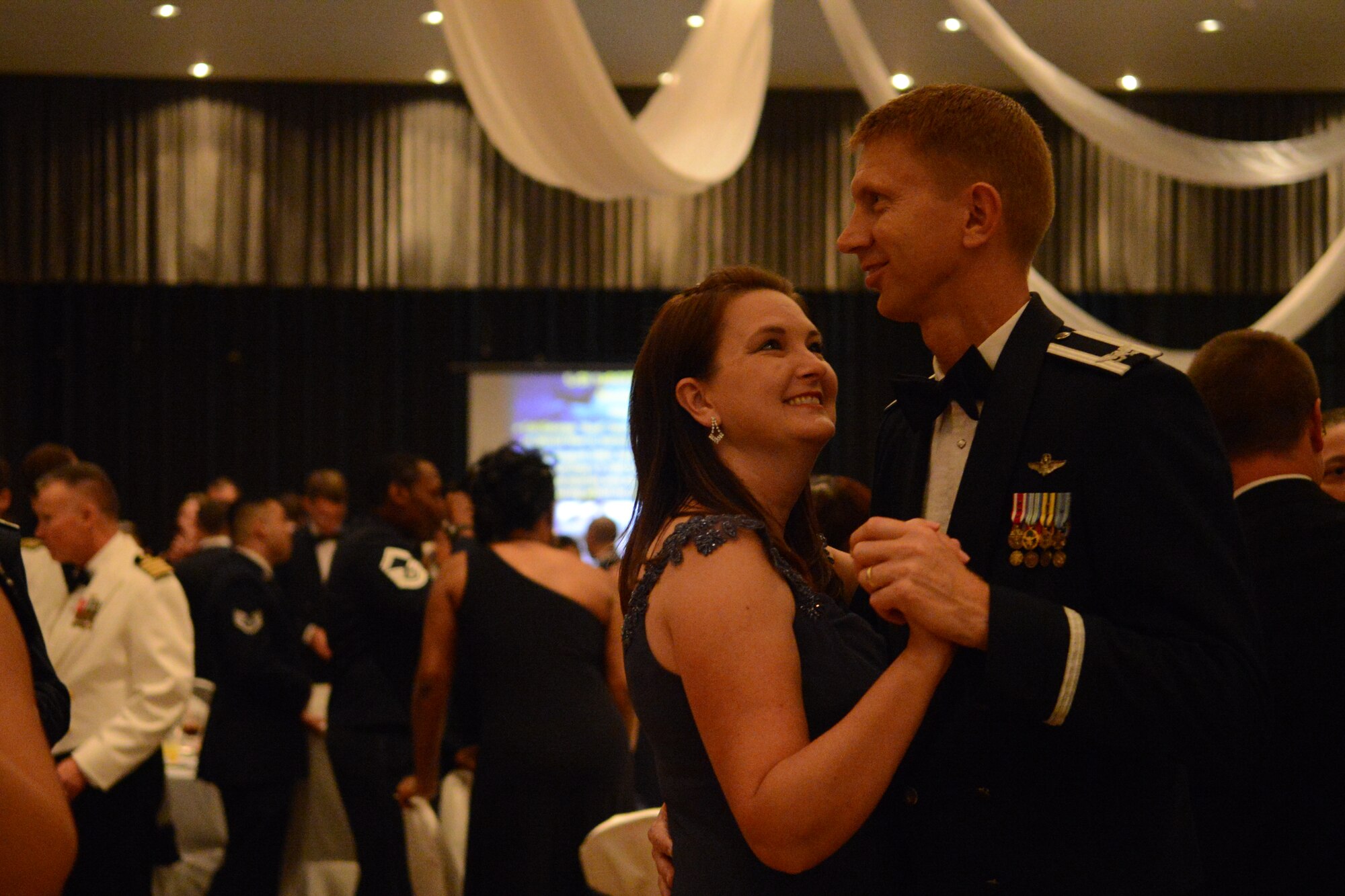 Col. Reid Langdon, 36th Operations Group commander, and his wife dance at the 66th Annual Air Force Ball Sept. 20, 2013, at Leo Palace in Yona, Guam. The Air Force Ball celebrates the creation of the U.S. Air Force as an independent service in 1947, when the Air Force separated from the U.S. Army. (U.S. Air Force Photo by Airman 1st Class Emily A. Bradley/Released)