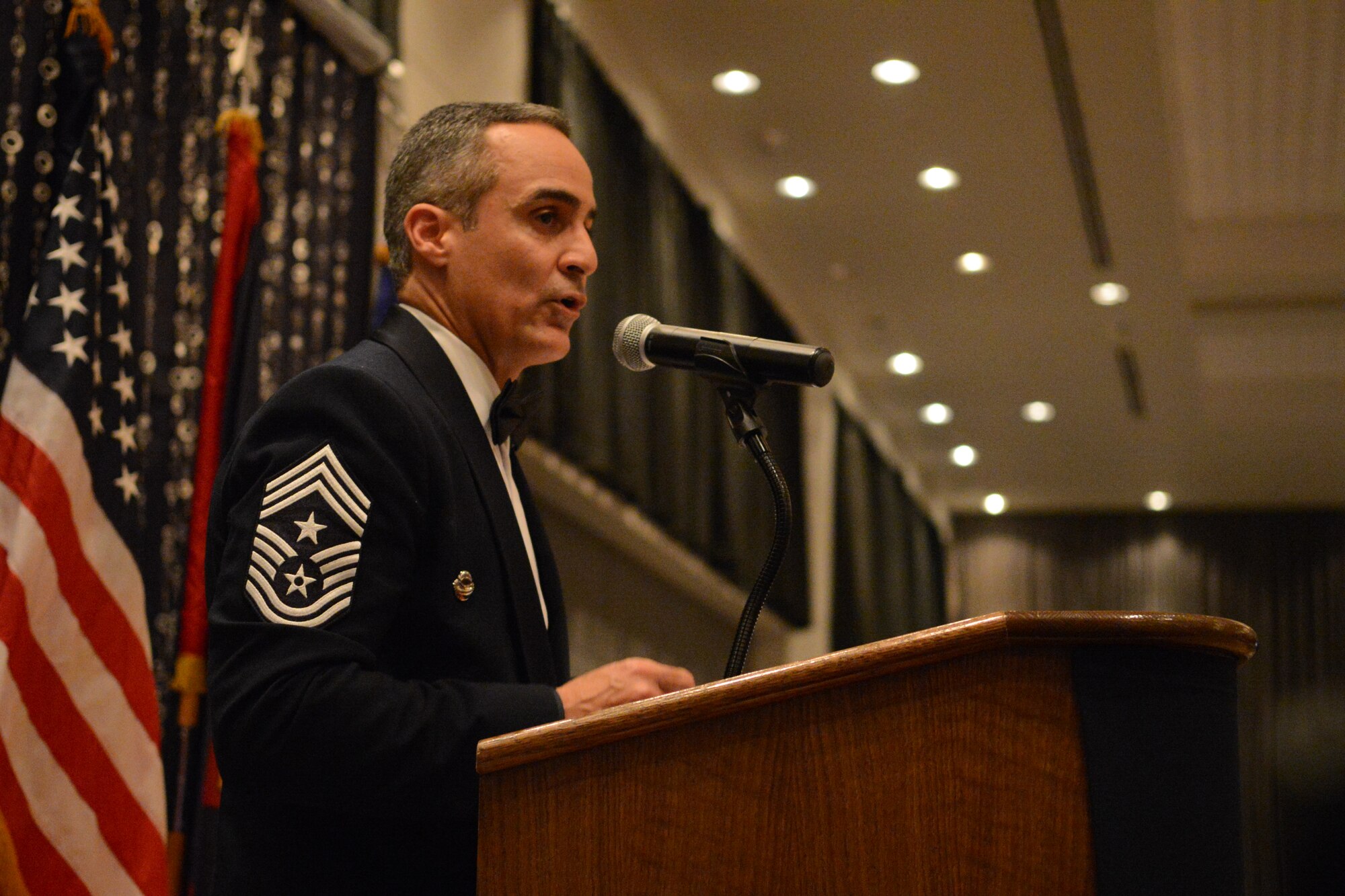 Guest speaker Chief Master Sgt. Ramon Colon-Lopez, 18th Wing command chief master sergeant from Kadena Air Base, Japan, delivers a speech at the 66th Annual Air Force Ball, Sept. 20, 2013, at Leo Palace in Yona, Guam. Colon-Lopez serves as the Kadena Air Base’s senior enlisted liaison between the 18th Wing and enlisted service members from five other Air Force major commands and joint partner units. (U.S. Air Force Photo by Airman 1st Class Emily A. Bradley/Released)