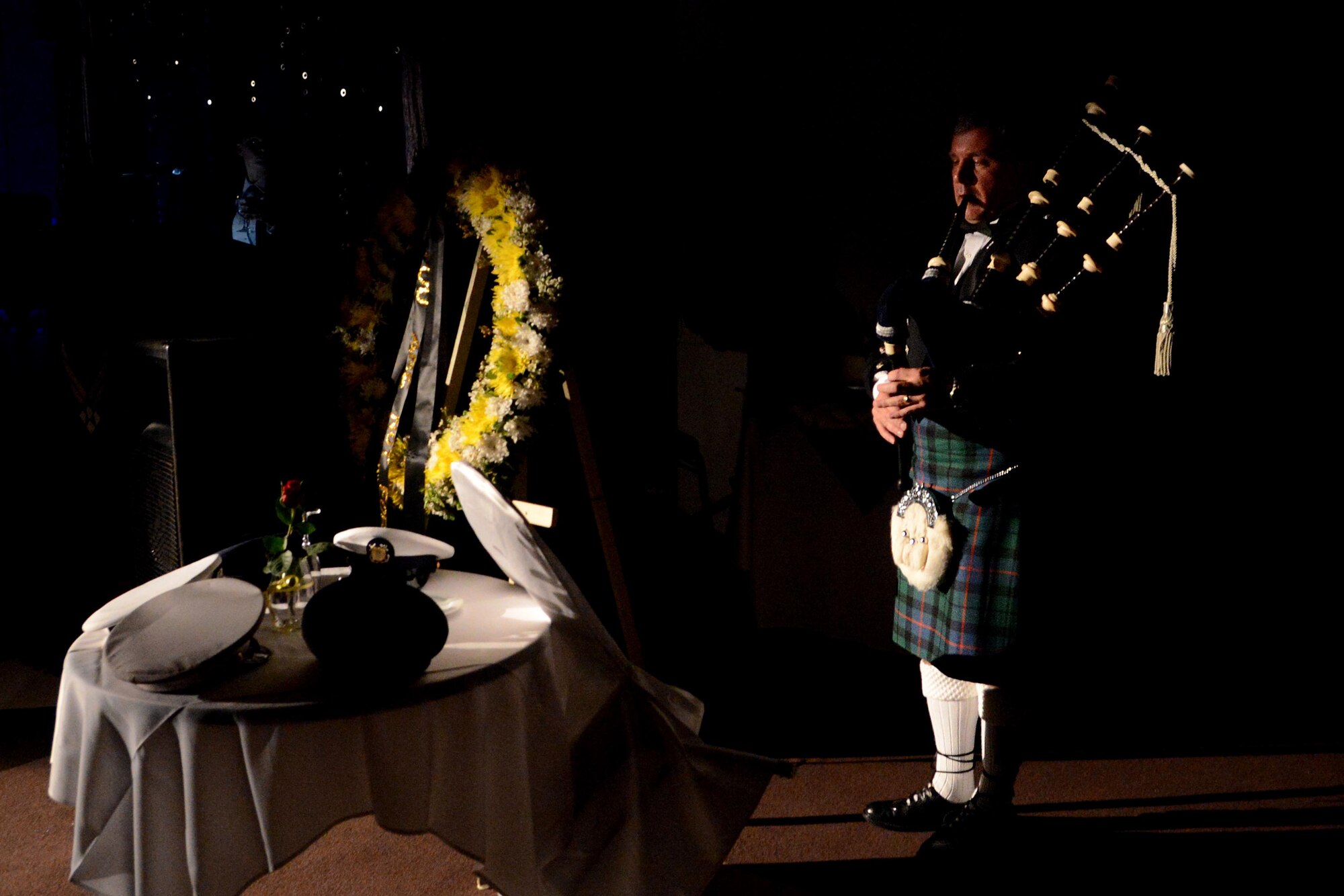 Master Sgt. Ian J. Morrison, 554th Red Horse 
Squadron superintendent, plays “Amazing Grace” on the bagpipes in remembrance of prisoners of war and those missing in action during the 66th Annual Air Force Ball Sept. 20, 2013, at Leo Palace in Yona, Guam. The POW/MIA table was displayed during the ball to pay tribute to service members who are not able to attend the event due to their sacrifice in their defense of freedom. (U.S. Air Force Photo by Airman 1st Class Emily A. 