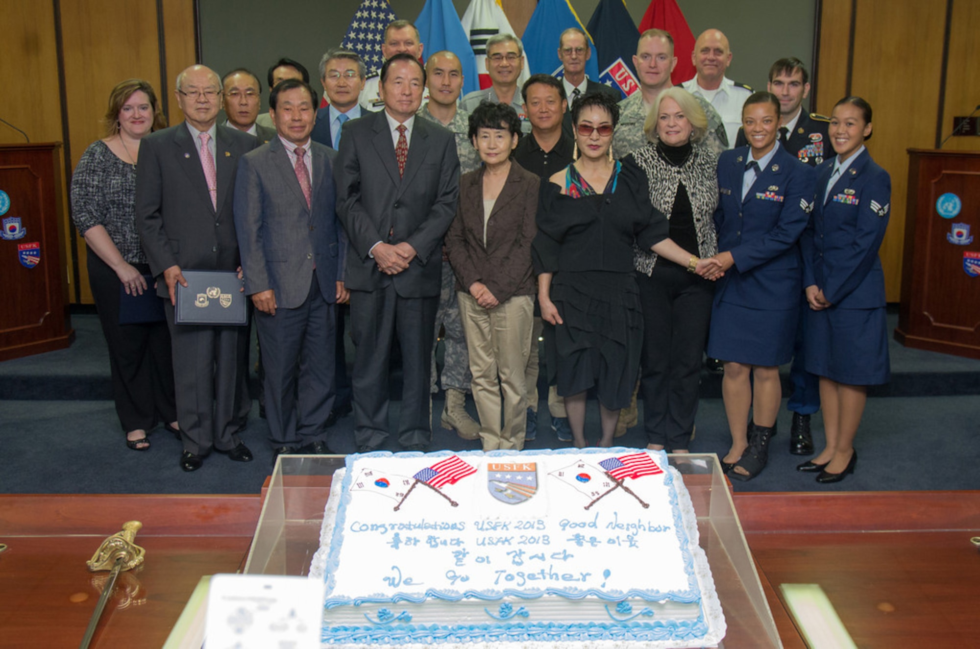 Gen. James D. Thurman, United Nations Command, Combined Forces Command and United States Forces Korea commander, presents awards to civilians and service members in recognition of their contributions in time in an effort to build strong bonds between the Korean people and service members of USFK on United States Army Garrison Yongsan, Republic of Korea, Sep. 23, 2013. (U.S. Army Photo/Sgt. Brian Gibbons)